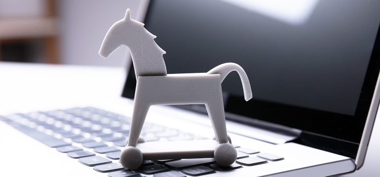 Close-up Of Trojan Horse Icon On Laptop Keypad